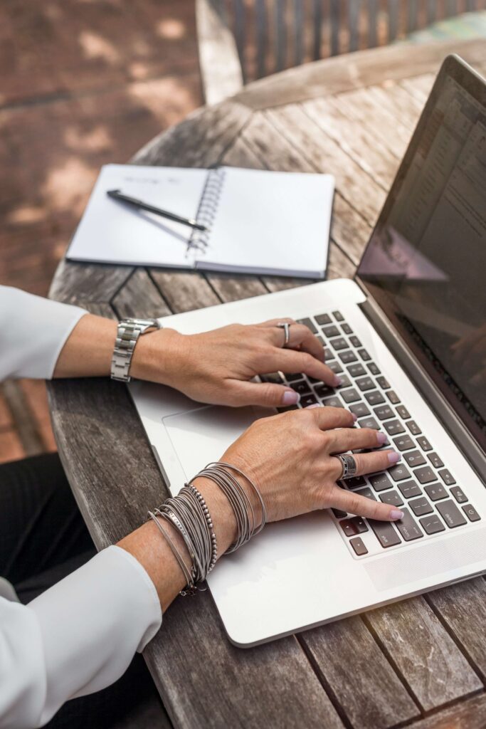 Woman using laptop for cloud based software